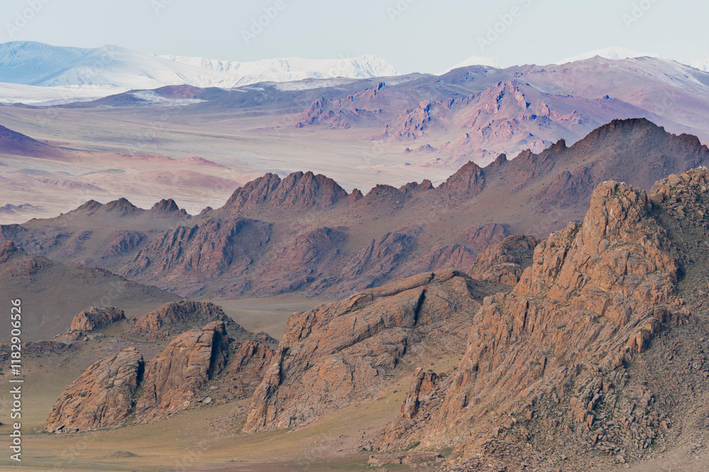 Naklejka premium Asia, Mongolia, Bayan-Olgii Province, Altai Mountains. Scenic view of the rugged mountains with grasslands in the foreground.