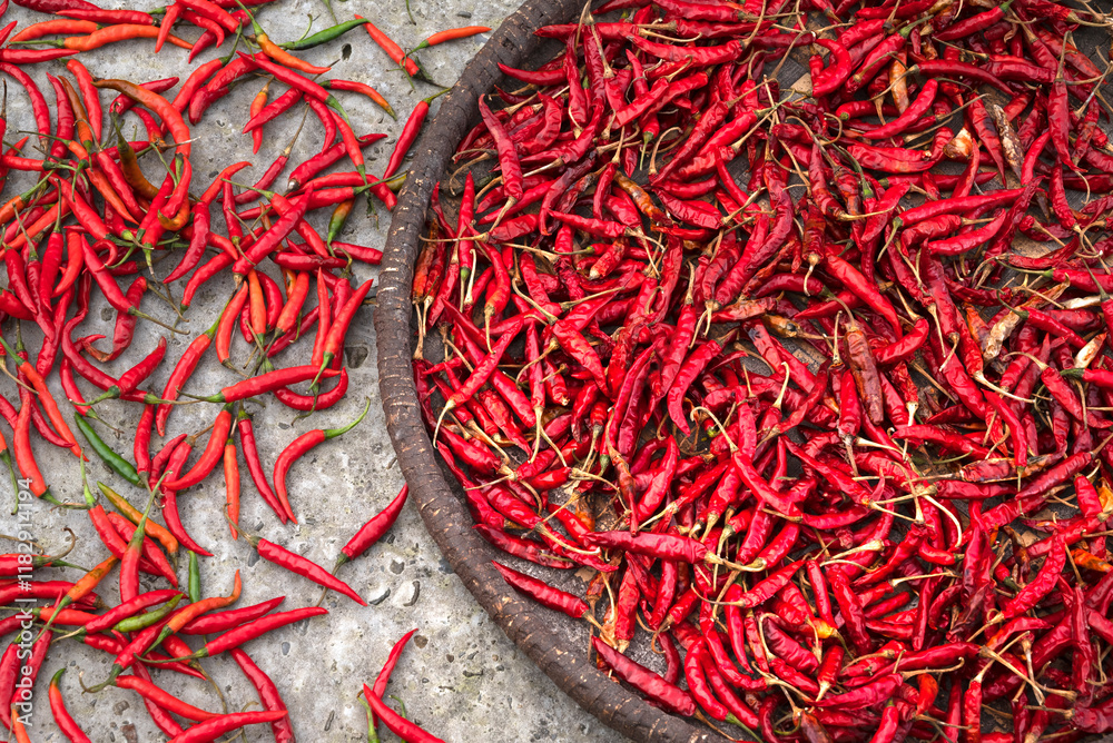 Fototapeta premium Nepal, drying peppers on the sidewalk