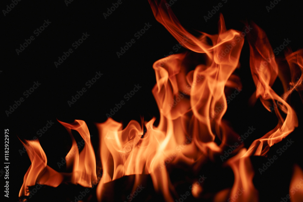 Fire over black background. Fire sparks background. Abstract blaze flames background. Burning fire. Texture of fire on a black background. Fire over black background. Fire sparks background. Abstract blaze flames background. Burning fire. Texture of fire on a black background.