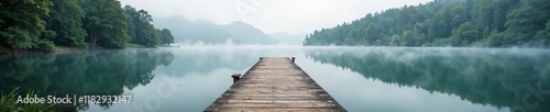 Wallpaper Mural Wooden pier extending into a still lake with surrounding trees and mist, tree, calm, border Torontodigital.ca