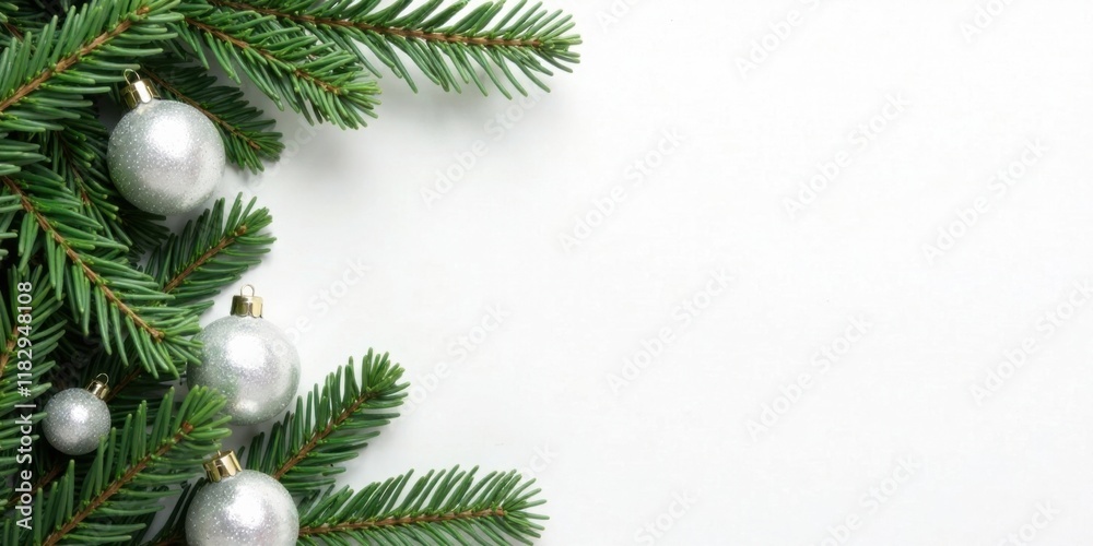 Silver ornaments and evergreen boughs on white background ideal for winter holiday greeting card design Silver ornaments and evergreen boughs on white background ideal for winter holiday greeting card design