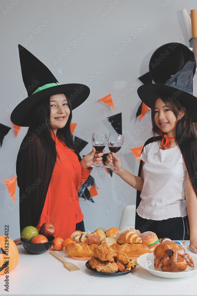Fototapeta premium friendship, holiday and people concept - group of happy smiling friends in halloween costumes of vampire, devil, witch and cheetah at home party