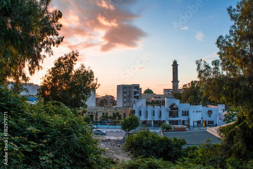 Muslim mosque for prayer and worship of Allah, Omar bin Abdul Aziz Mosque, Jijel State, Algeria, North African mosques in village on Mediterranean coast, Minaret and dome of  mosque, Ramadan iftar.