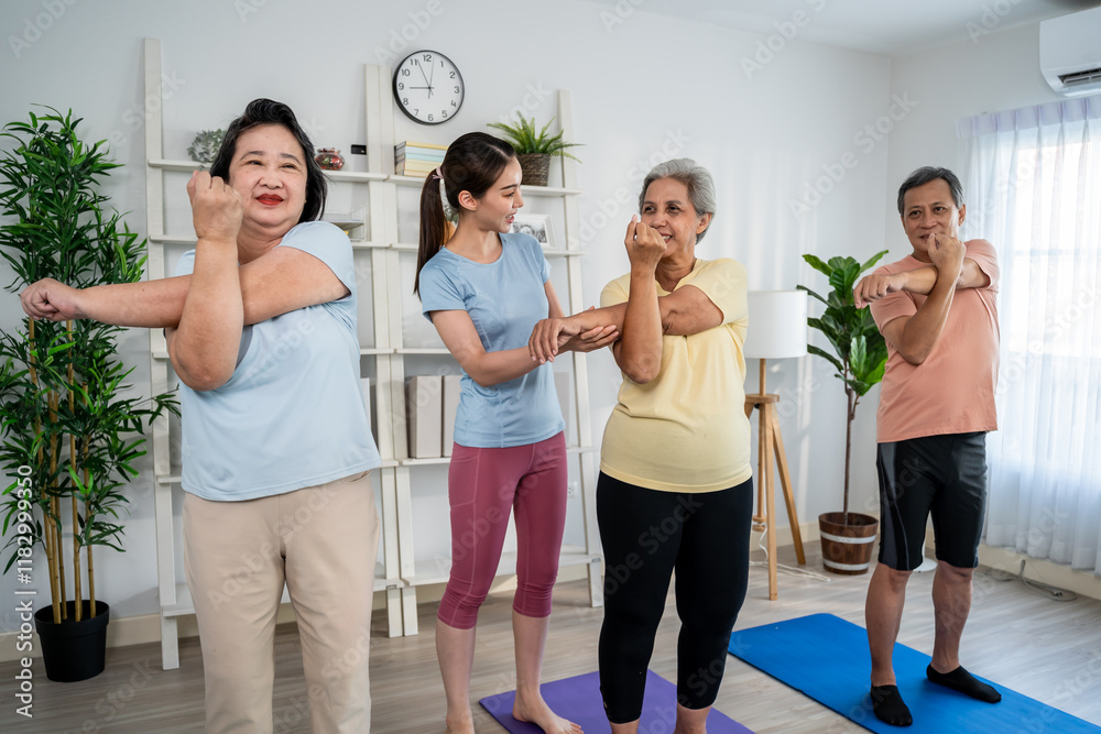 Fototapeta premium Group of elderly man and woman doing exercise with trainer at nursing home. 