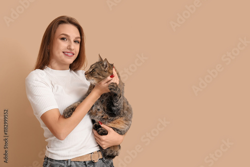 Pretty young woman holding ...