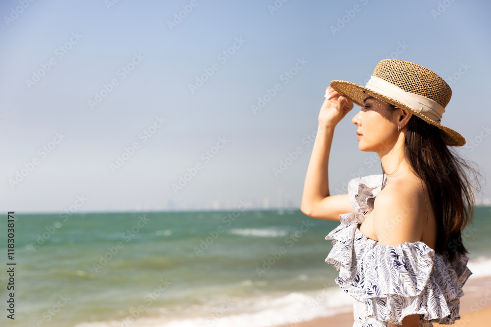 Portrait of a beautiful Asian woman relaxing on a tropical beach, summer vacation Portrait of a beautiful Asian woman relaxing on a tropical beach, summer vacation