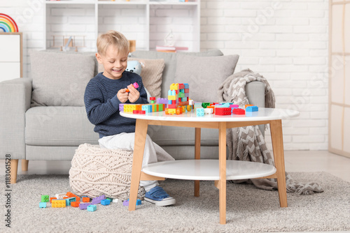 Happy cute little boy playi...