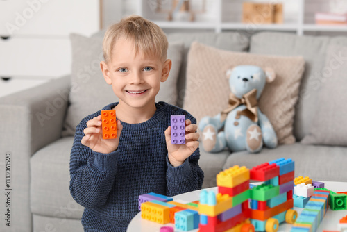 Happy cute little boy playi...