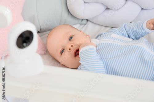 Cute little baby lying in c...