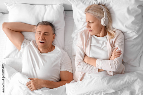 Irritated mature woman in h...