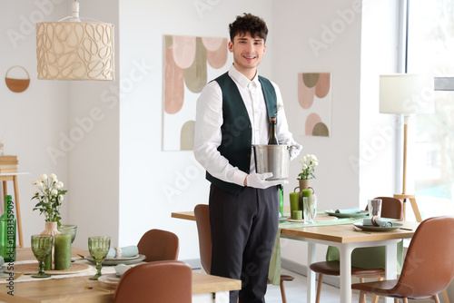 Male waiter with champagne ...