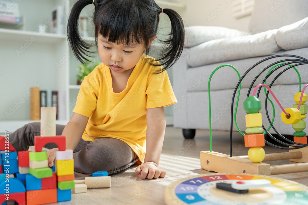 Happy Asian child playing and learning toy blocks. children are very happy and excited at home. child have a great time playing, activities, development, attention deficit hyperactivity disorder Happy Asian child playing and learning toy blocks. children are very happy and excited at home. child have a great time playing, activities, development, attention deficit hyperactivity disorder