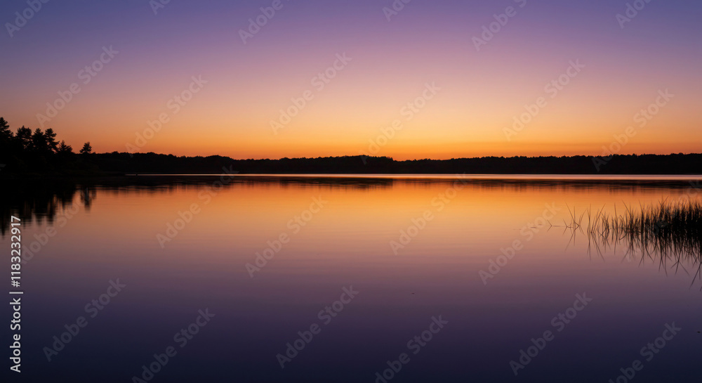 A serene twilight sky reflected in a calm lake, with hues of deep purple and soft orange blending in the still waters A serene twilight sky reflected in a calm lake, with hues of deep purple and soft orange blending in the still waters