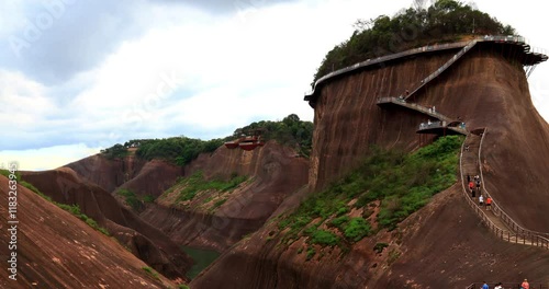 Time lapse of Gaoyi Ridge Danxia landform.Gaoyi Ridge(Gaoyiling) Scenic Area is located in Chenzhou City of Hunan Province, which is dominated by Danxia landform. The peaks of Gaoyi Ridge are steep  photo