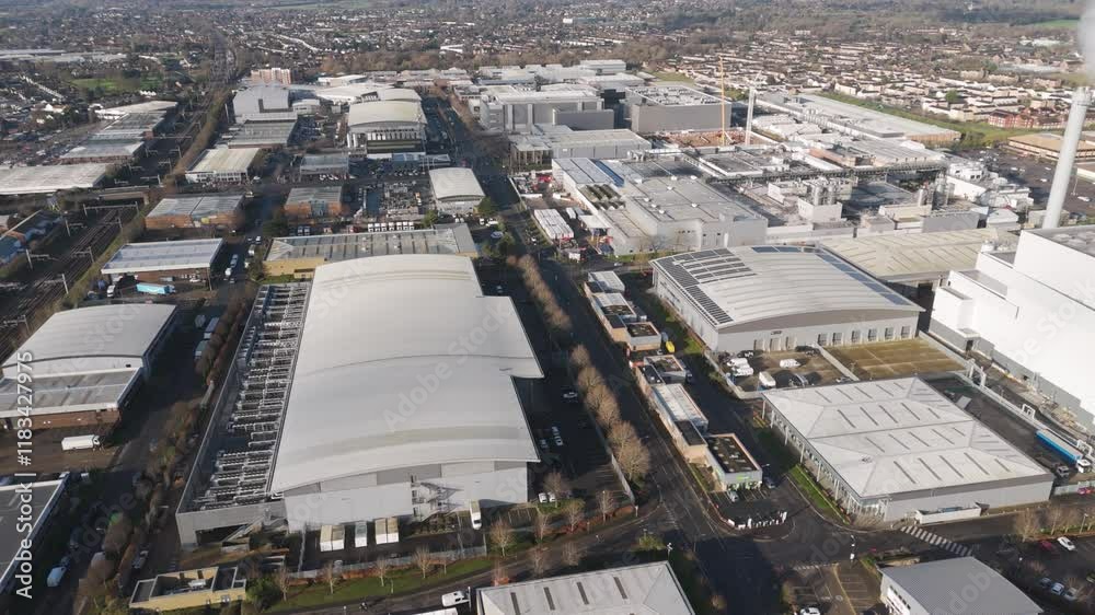 Aerial of a modern industrial estate featuring well planned warehouses, robust road infrastructure, and active commercial logistics