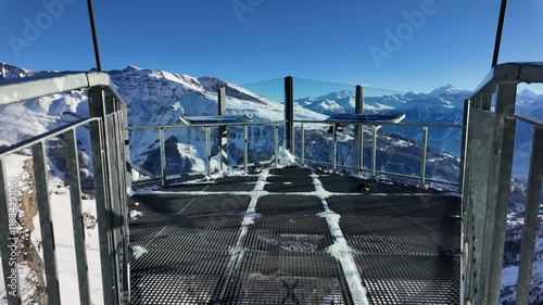 Video recording at a Gemmi viewing point. You can see the huge mountain landscapes and mountain ranges in the snow-covered winter. Unique snow landscape. photo