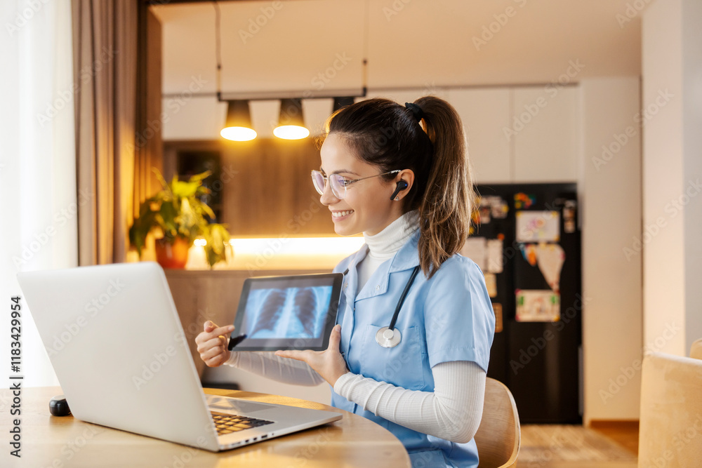 Portrait of smiling doctor showing x-ray scan on tablet on online consultations form home. Portrait of smiling doctor showing x-ray scan on tablet on online consultations form home.
