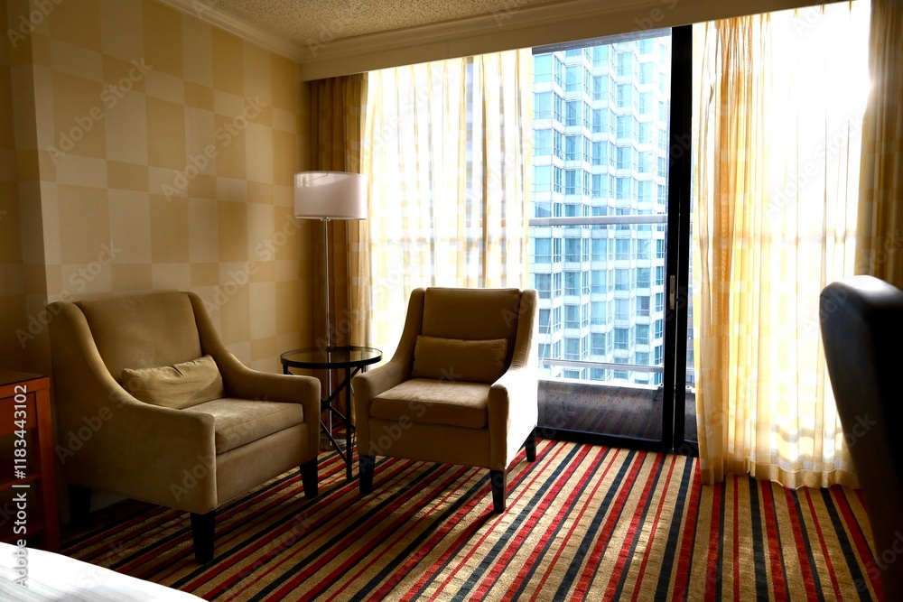 Fototapeta premium Hotel room with panoramic window and large bed