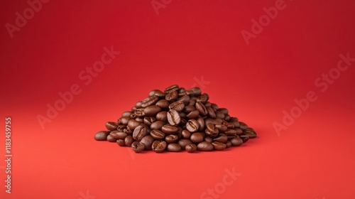 A vibrant pile of roasted coffee beans on a red background, highlighting their rich color and texture. photo