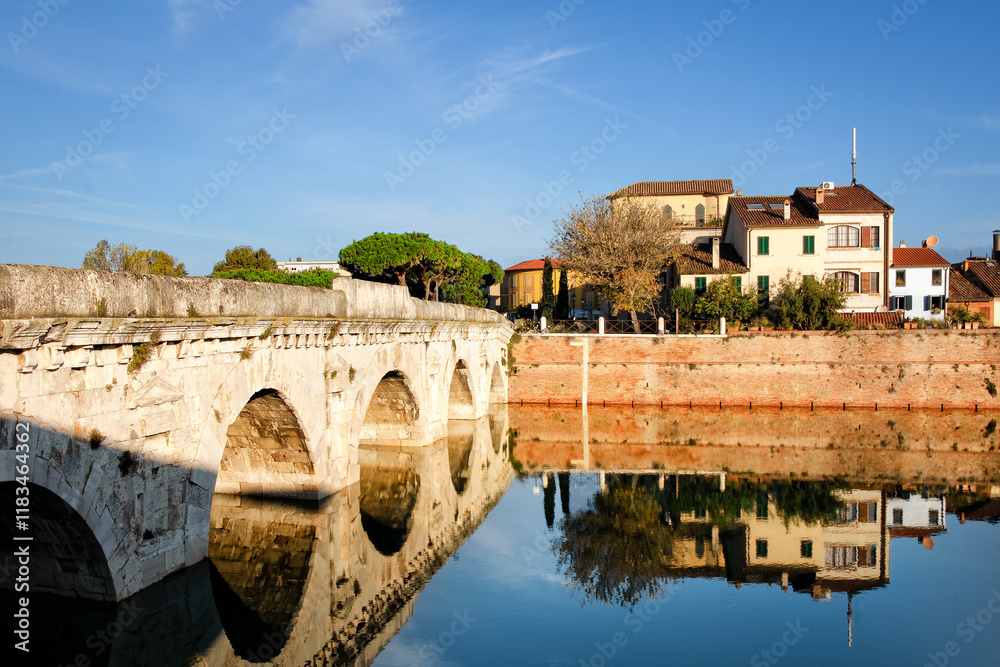 Morning view to Bridge of Tiberius in Rimini, Italy. Constructed between 14 and 21 AD. Copy space in sky.