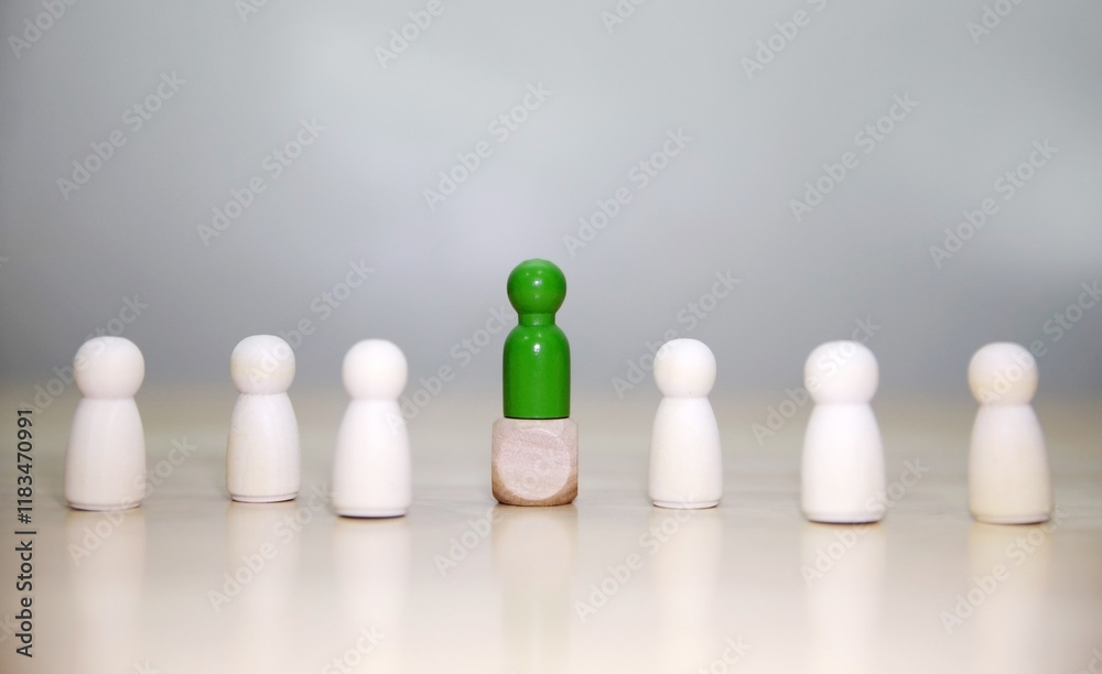 Wooden person model among people, Leadership concept.3D rendering on white background Wooden person model among people, Leadership concept.3D rendering on white background