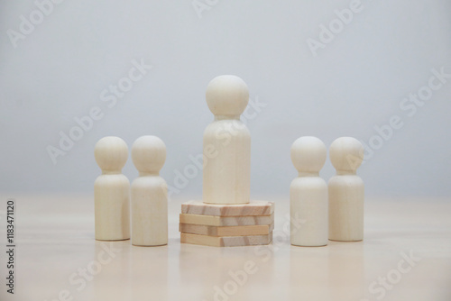 Wooden person model among people, Leadership concept.3D rendering on white background photo