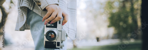 Tourist girl taking pictures of nature with her camera, photo