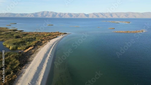 Wallpaper Mural  Scenic view of a tranquil shoreline and lush vegetation along a serene blue lake. Aerial shot Lake Sevan in Armenia, Caucasus. Diablo lake aerial view. Wild white beach near  mountain lake.  Torontodigital.ca