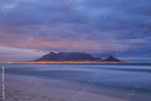 Table Mountain and City Lights at Night from Bloubergstrand, South Africa photo