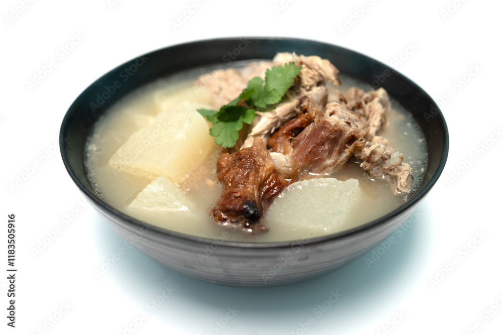 Stewed radish with roasted duck bones on isolate white background, Close up. Stewed radish with roasted duck bones on isolate white background, Close up.