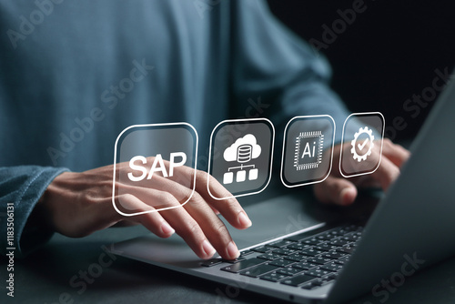 Person using laptop with SAP icon on virtual screen for business process automation software and management software, SAP or ERP enterprise resources planning system concept. photo