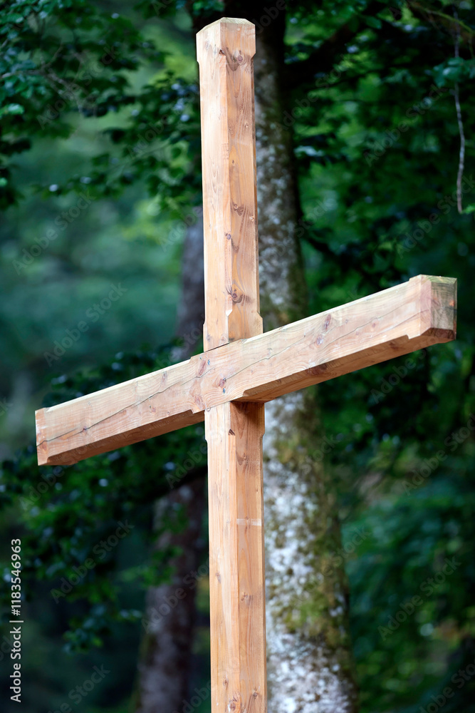 Fototapeta premium Wooden cross in nature. Christian symbol. Faith and spirituality.