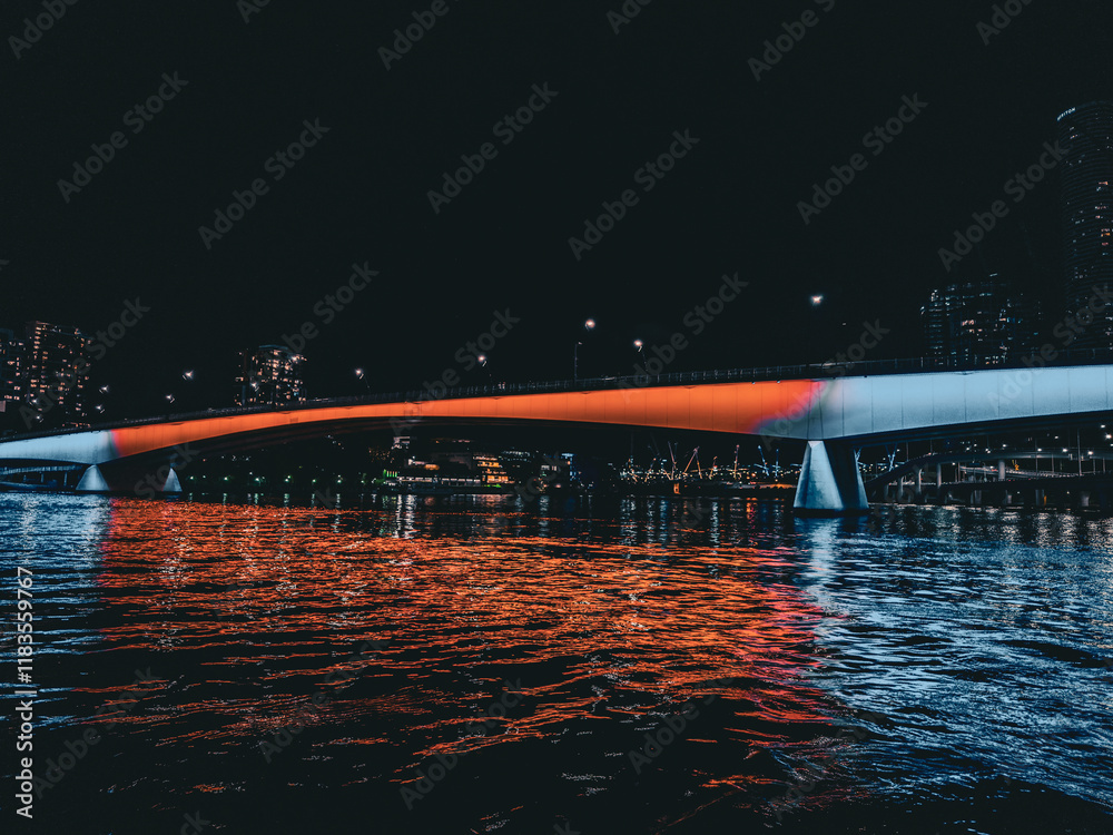 Naklejka premium Brisbane City at Night: Illuminated Skyline and Vibrant Urban Landscape. Queensland. Australia