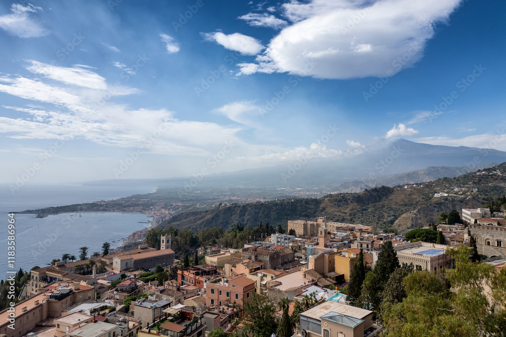 Naklejka premium View of Taormina with the Etna volcano in the background in Sicily