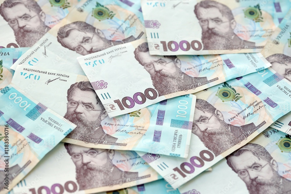 Obraz premium Big amount of ukrainian new one hundred hryvnia money bills with modern design. Financial concept, business