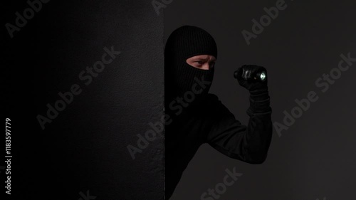 Masked Figure Observing from the Shadows