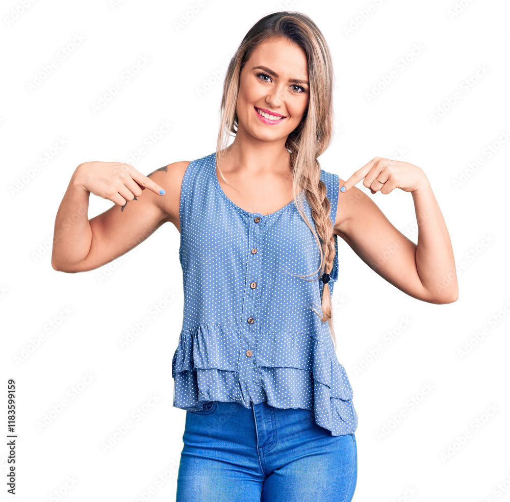 Obraz premium Young beautiful blonde woman wearing casual sleeveless t-shirt looking confident with smile on face, pointing oneself with fingers proud and happy.