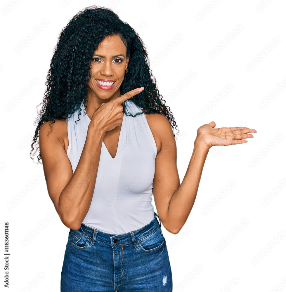 Φωτογραφία Middle age african american woman wearing casual style with sleeveless shirt amazed and smiling to the camera while presenting with hand and pointing with finger