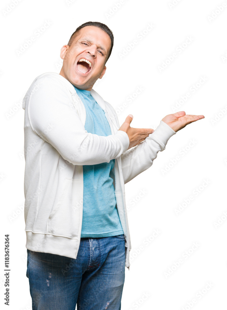 Middle age arab man wearing sweatshirt over isolated background Pointing to the side with hand and open palm, presenting ad smiling happy and confident Middle age arab man wearing sweatshirt over isolated background Pointing to the side with hand and open palm, presenting ad smiling happy and confident