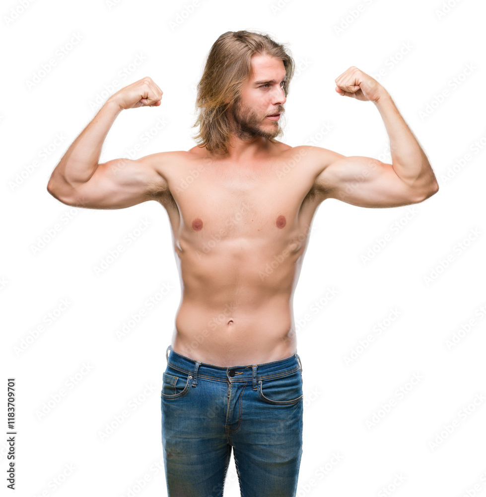 Young handsome shirtless man with long hair showing sexy body over isolated background showing arms muscles smiling proud. Fitness concept.