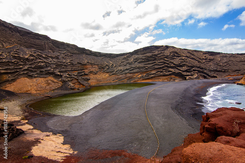 Road and lake admist the volcanoes af Lanzarote photo