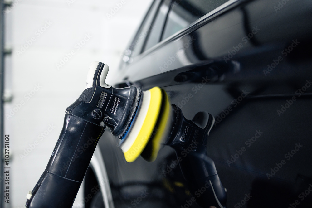 Close up view of polishing grinder working on a car body. Close up view of polishing grinder working on a car body.