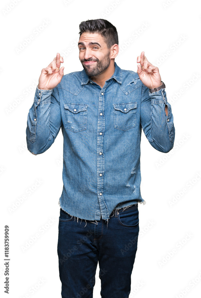 Young handsome man over isolated background smiling crossing fingers with hope and eyes closed. Luck and superstitious concept. Young handsome man over isolated background smiling crossing fingers with hope and eyes closed. Luck and superstitious concept.