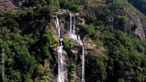 aerial close-up of Acquafraggia Waterfalls and the high cliffs near Italian village of Borgonuovo, Italy photo