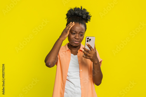 Obraz na plátně Upset sad African American woman use smartphone typing browsing play game loses surprised by sudden lottery results bad fortune loss fail unlucky news