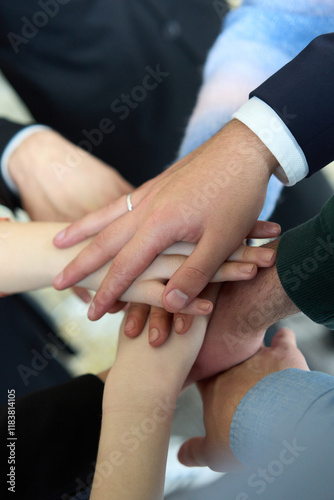 Wallpaper Mural A top view of business people joining hands in a circle, symbolizing unity, collaboration, and shared success in the workplace Torontodigital.ca