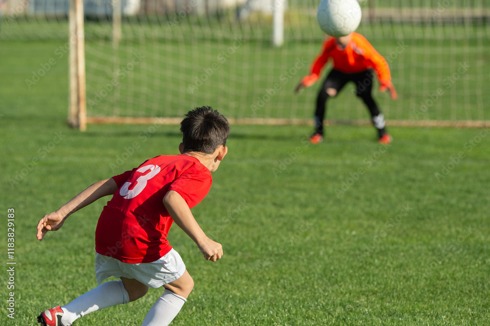Young boy shooting soccer ball Young boy shooting soccer ball