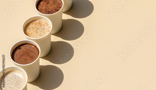 Canvas Print A selection of different coffee drinks served in takeaway cups, showcasing various coffee styles