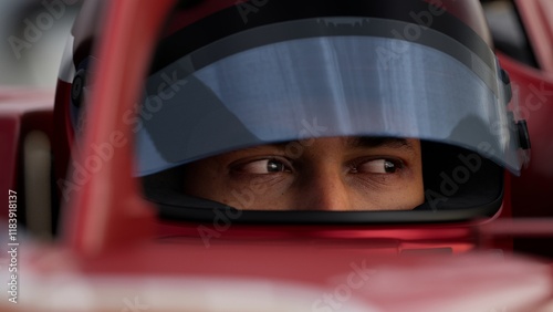 Close-up of a focused pilot driver in a red racing car, preparing for a race
