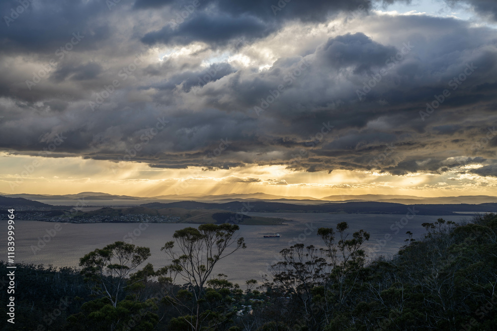 Naklejka premium dawn golden sunrise over hobart over the ocean